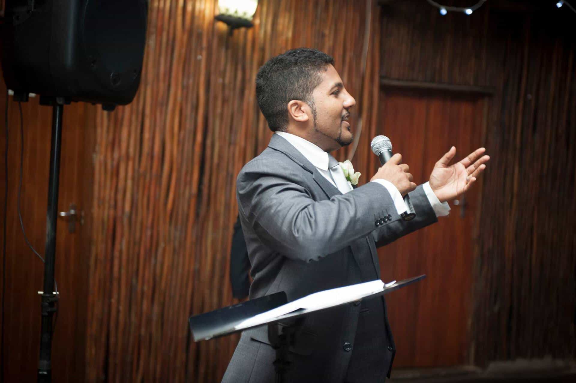 Muneer speaking at an event